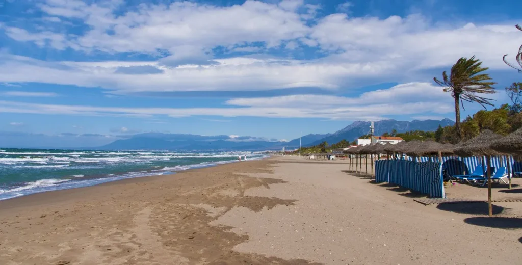 Playa Real de Zaragoza wide golden sands and gentle shallow waters in Elviria Marbella