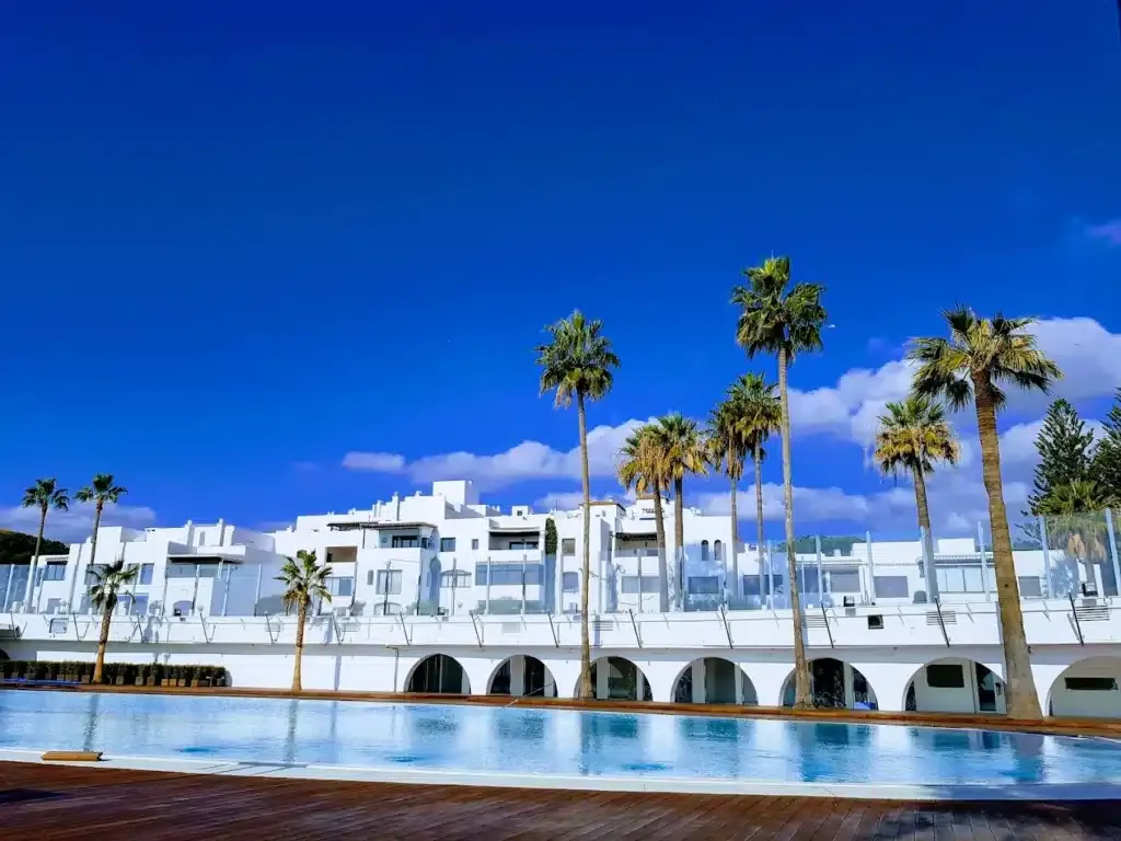 Outdoor swimming pool and white facade at Benabola Hotel Puerto Banus Marbella