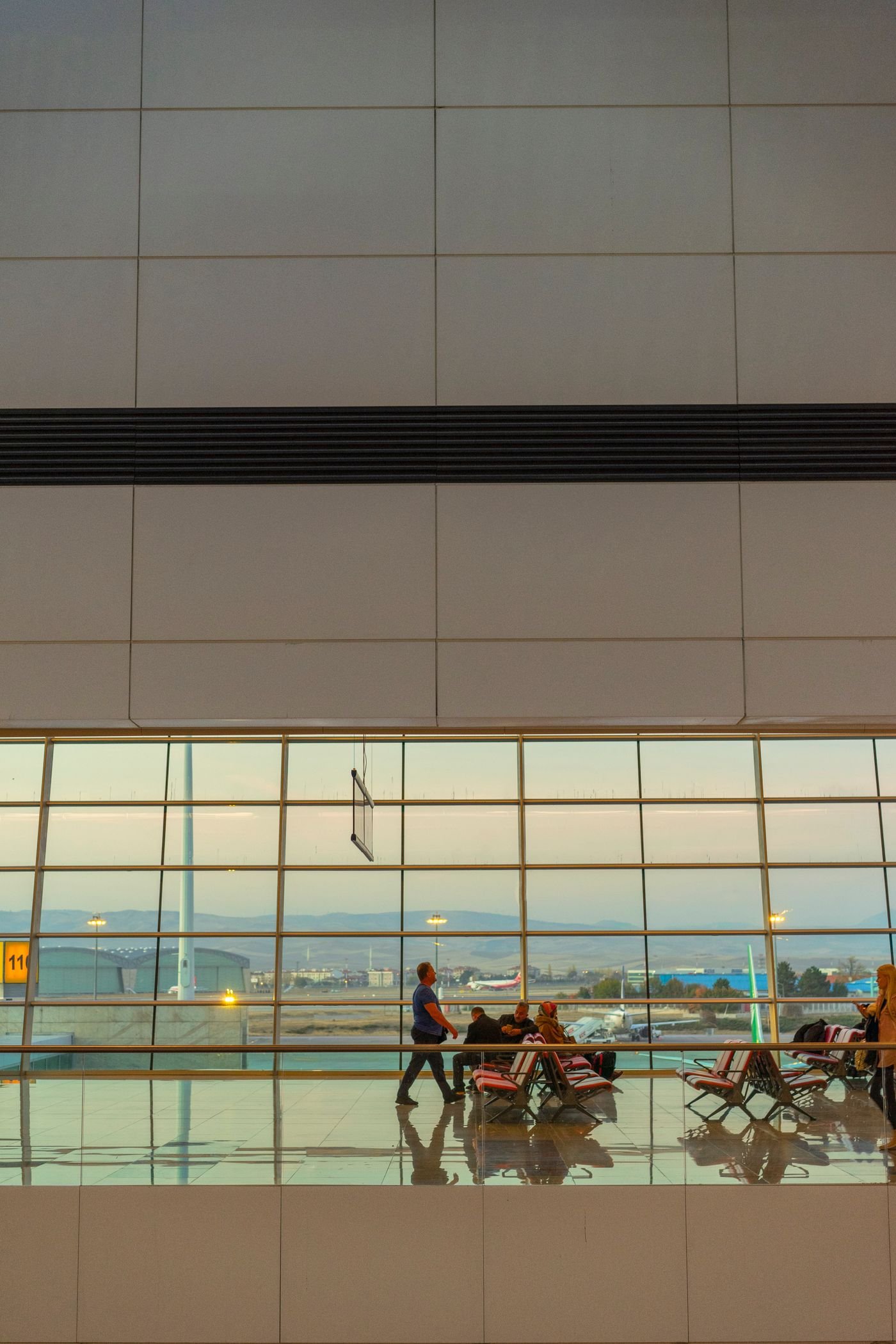 Passengers waiting in a modern airport terminal