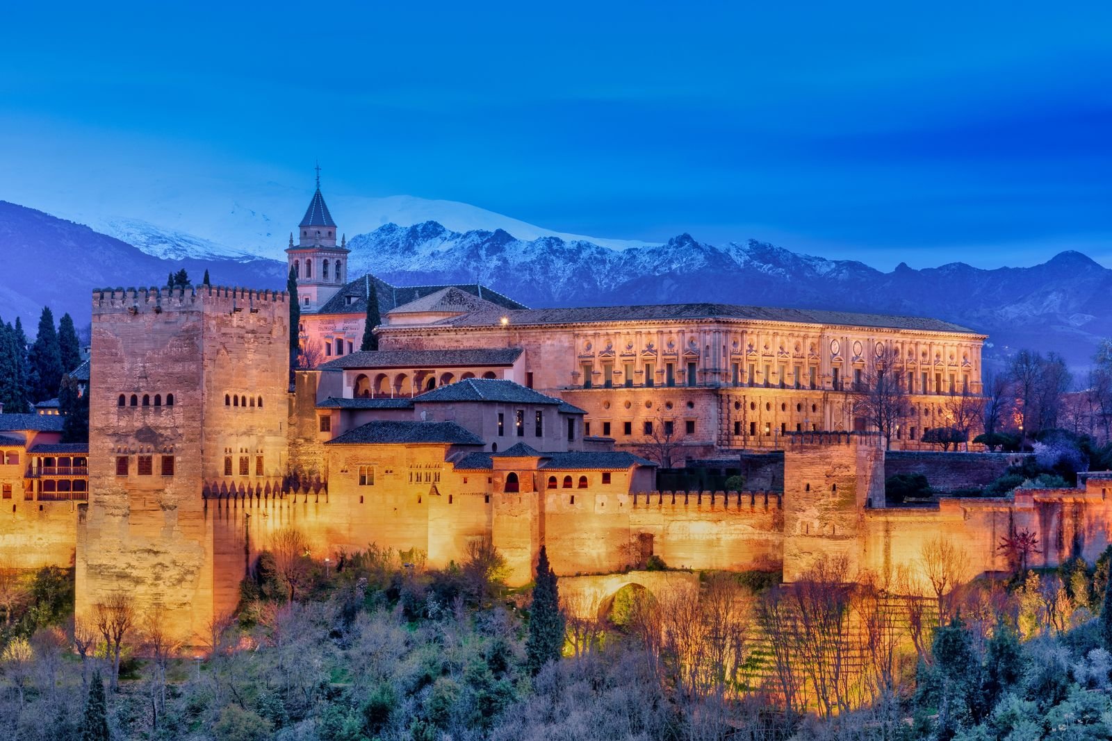 The Alhambra in Granada with the snow-capped Sierra Nevada behind it in winter