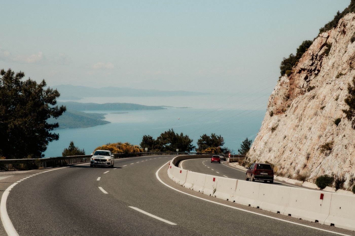 Coastal road with sea views and cars