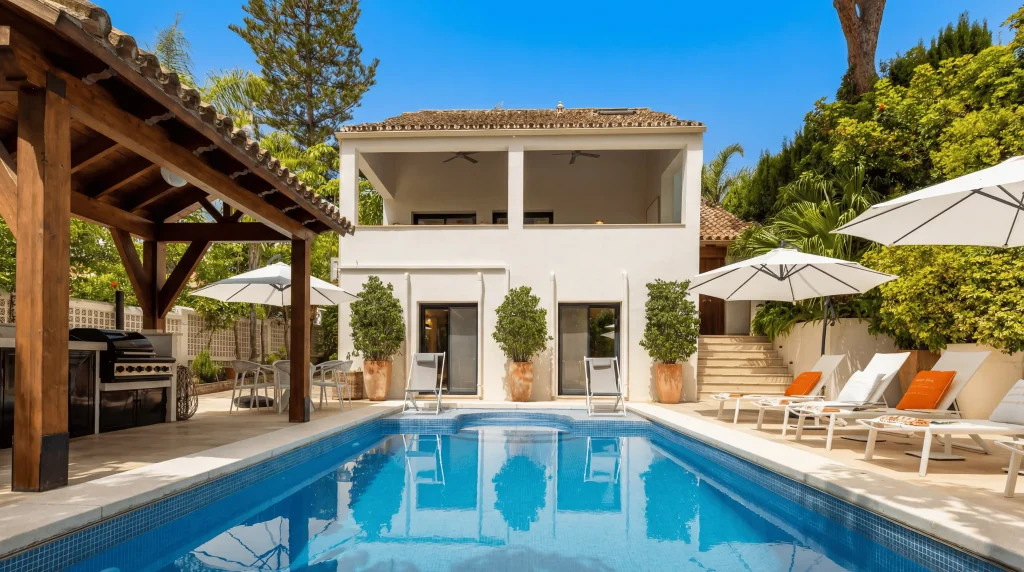 La Cabane luxury beach resort villa swimming pool and sun loungers in Los Monteros Marbella