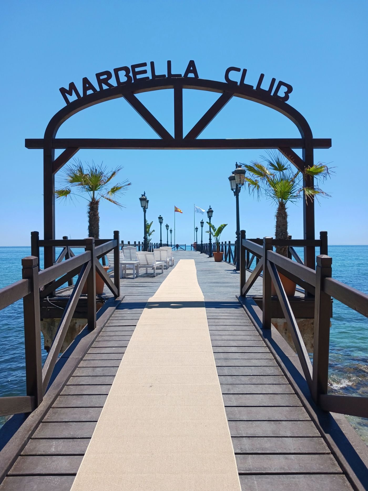 Wooden pier on Nagüeles beach on Marbella's Golden Mile