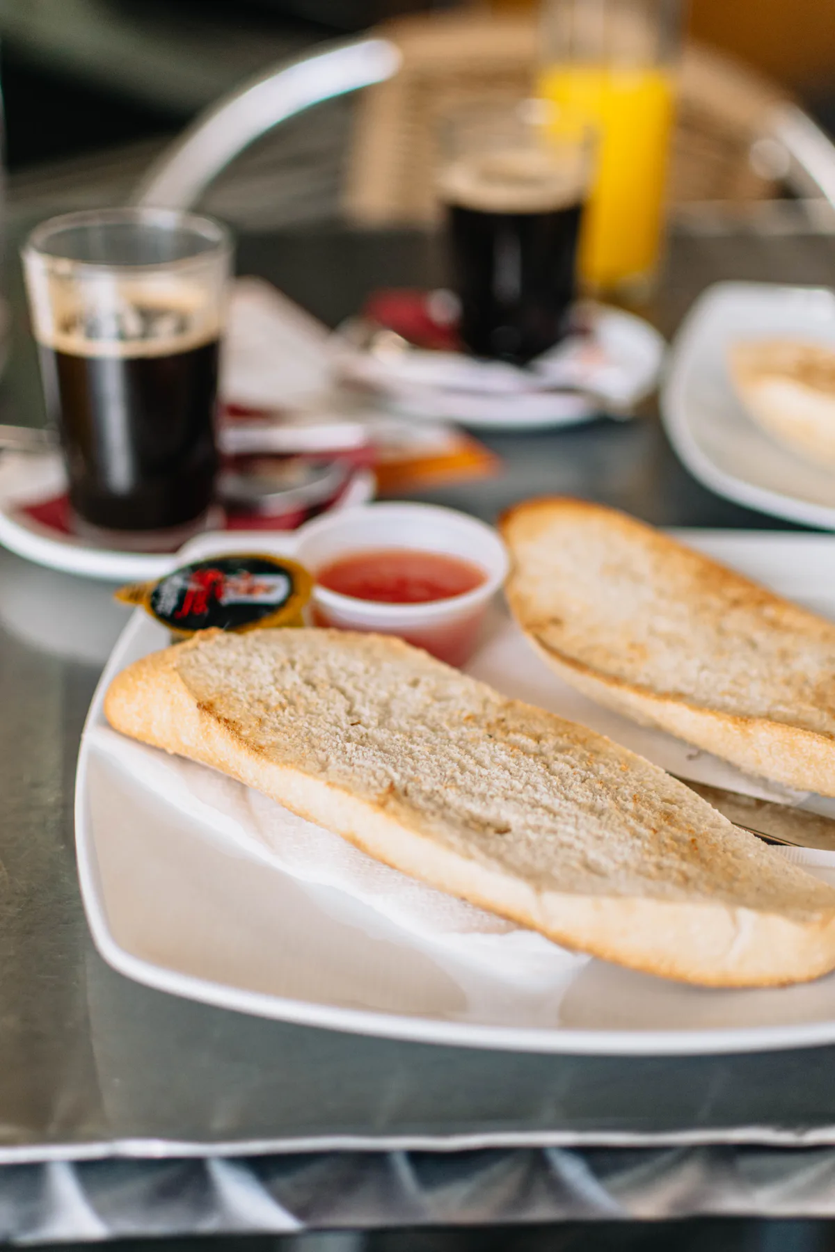 Breakfast of toast, jam and coffee on a café table