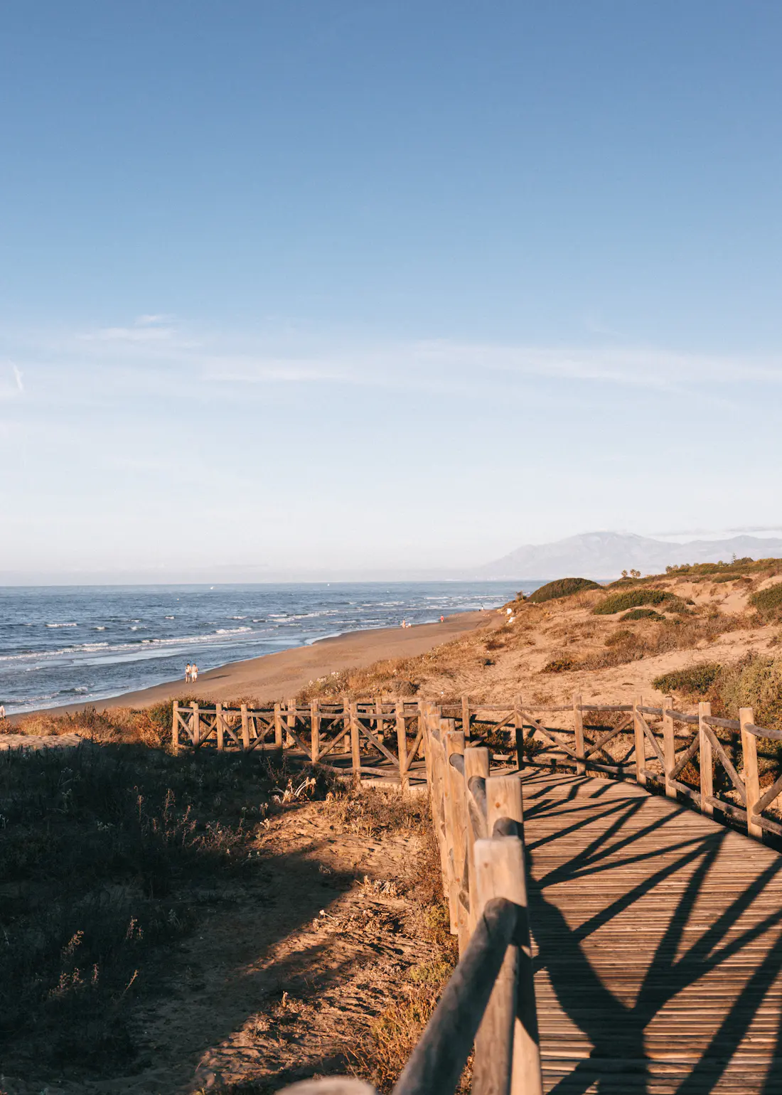 Wooden boardwalk leading to the beach at Cabopino, Marbella
