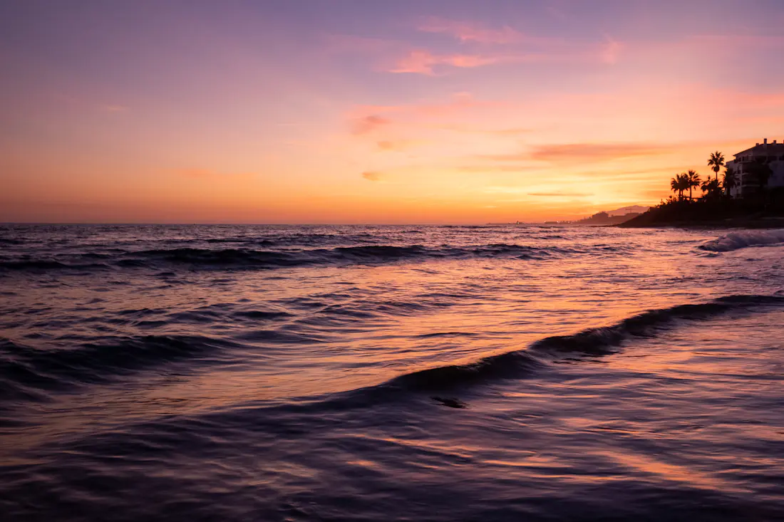 Sun setting over the Mediterranean Sea from a beach in Marbella